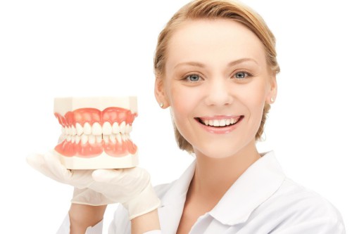A female dentist with dentures